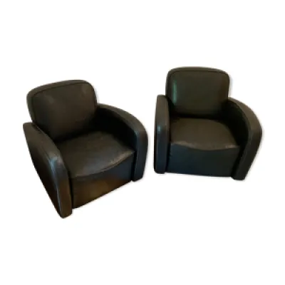 deux fauteuils en cuir