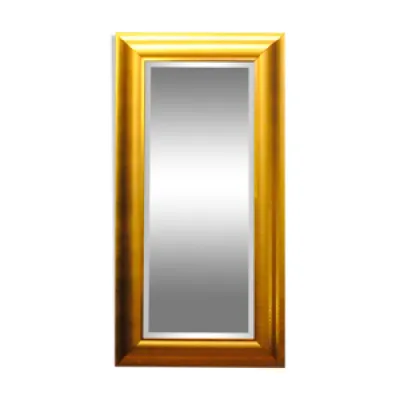 Large mirror in a golden decorative