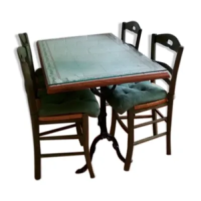 table fer forgé et carrelage - bois chaises