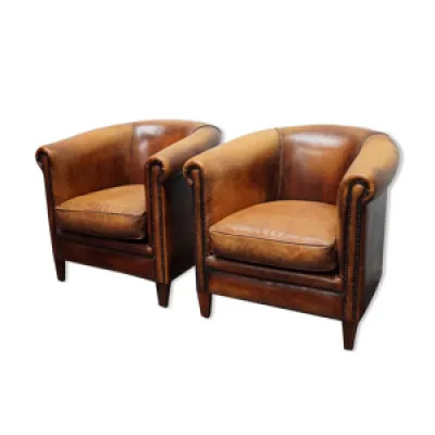 Paire de fauteuils en - cuir couleur cognac