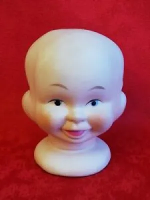 Tête de poupée en porcelaine - faces