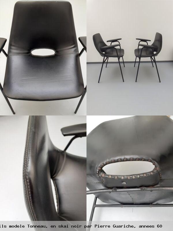 Paire de fauteuils modele tonneau en skai noir par pierre guariche annees 60